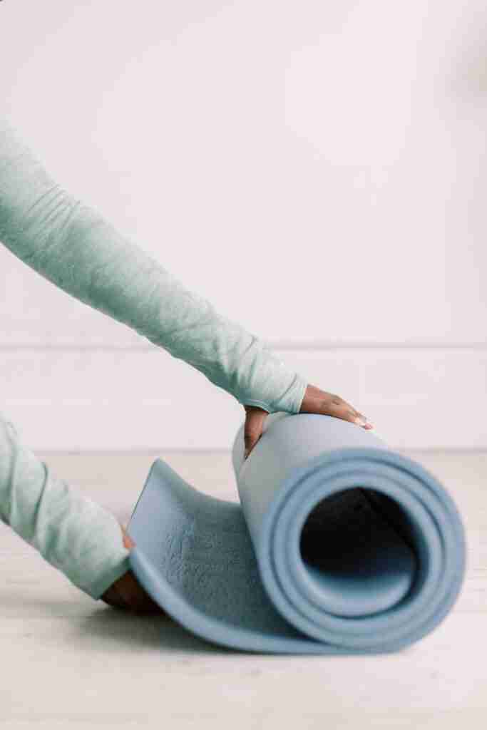 Dance Studio Owner With Blue Yoga Mat